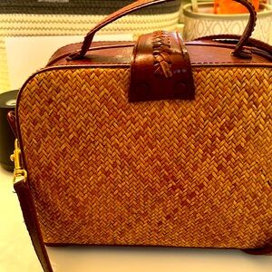 Straw/ leather top handle bag with crossbody strap. Snap closure